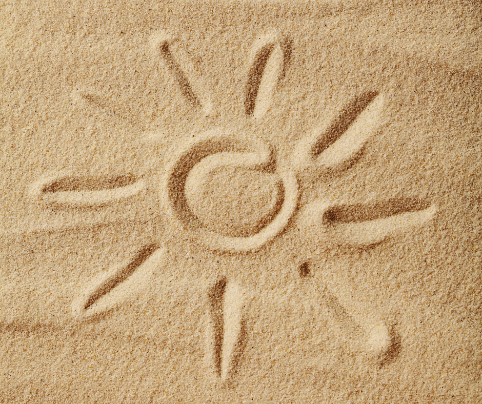 soleil dessiné dans le sable